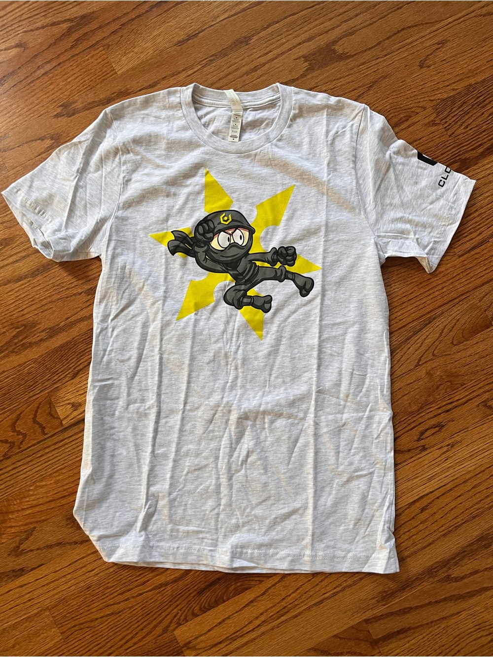 Men's White Graphic Ninja Tee with Yellow Star